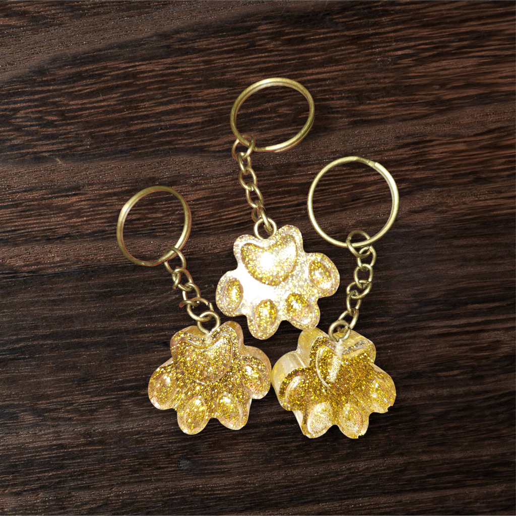 Gold paw print keychains