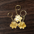 Gold paw print keychains