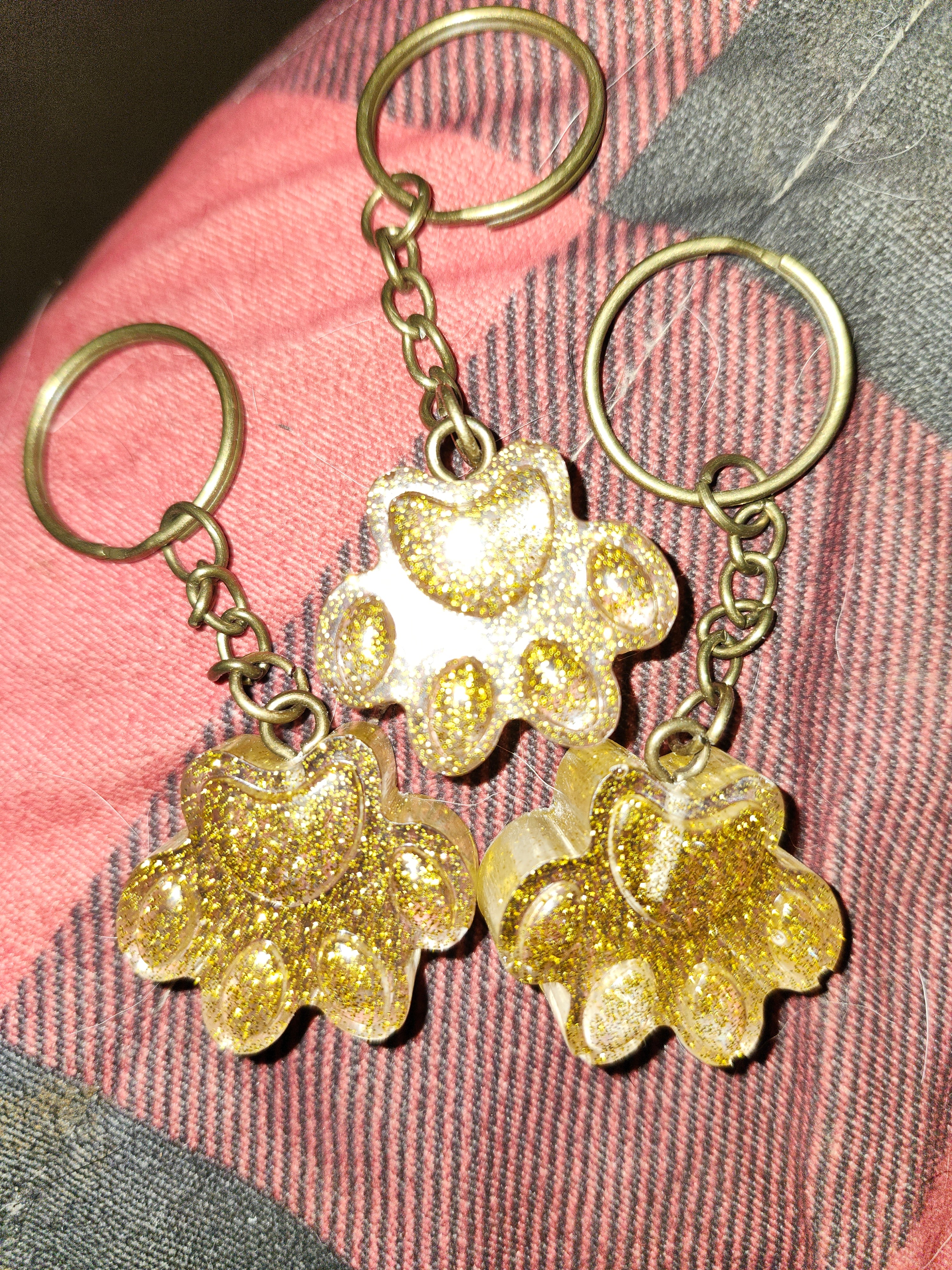 Gold paw print keychains